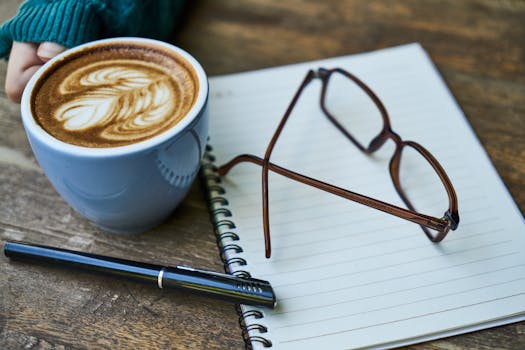 image of a person journaling with a cup of coffee