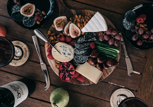 a variety of nuts on a wooden table
